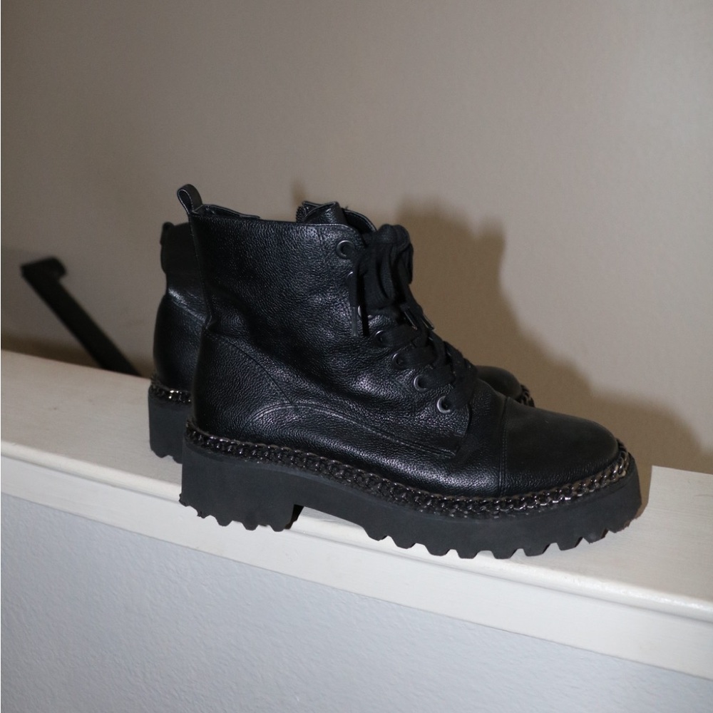 Black leather ankle boots with a punk vibe